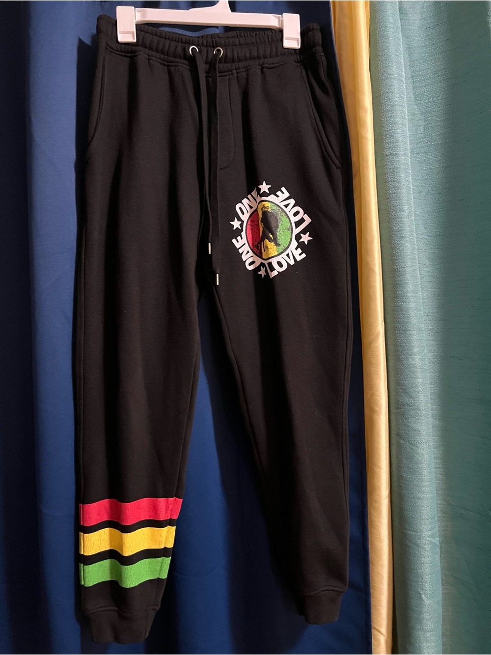 Black Sweatpants with 'One Love' Graphic and Rasta Stripes